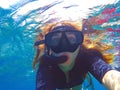 Beautiful woman under water before dive to coral reef Royalty Free Stock Photo