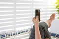 A beautiful woman using her mobile phone on the travel bus Royalty Free Stock Photo