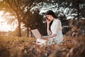 Beautiful woman using laptop in the park Royalty Free Stock Photo