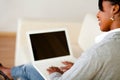 Beautiful woman using laptop while is sitting Royalty Free Stock Photo