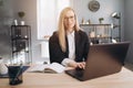 Beautiful woman using laptop for working at business center Royalty Free Stock Photo