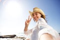 Beautiful woman on vacation at beach taking selfie Royalty Free Stock Photo