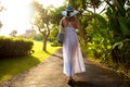 Woman on vacation walking in tropical park