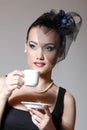 Beautiful woman in veil retro glamour portrait with cup of tea o Royalty Free Stock Photo