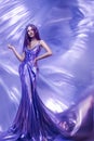 Beautiful woman in violet shining dress
