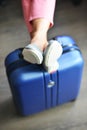 Beautiful woman waiting for delayed or connection flight with luggage in airport