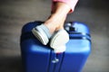 Beautiful woman waiting for delayed or connection flight with luggage in airport Royalty Free Stock Photo