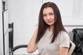 Beautiful woman waiting for hairdresser in salon