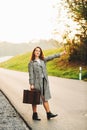 Beautiful woman walking away down the road Royalty Free Stock Photo