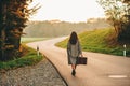 Beautiful woman walking away down the road Royalty Free Stock Photo