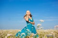 Beautiful woman walking on flower field Royalty Free Stock Photo