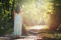 Beautiful woman walking forest path Royalty Free Stock Photo