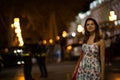 Beautiful woman is walking in the night city. Royalty Free Stock Photo