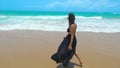 Beautiful woman walking on the sand of a beautiful beach