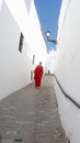 Beautiful woman walking by the streets of Vejer de la Frontera