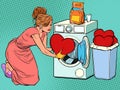 Beautiful woman washes a red heart. Valentines day