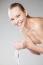 Beautiful woman washing her clean face with water Royalty Free Stock Photo