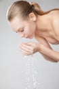 Beautiful woman washing her clean face with water Royalty Free Stock Photo