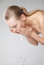 Beautiful woman washing her clean face with water Royalty Free Stock Photo