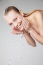 Beautiful woman washing her clean face with water Royalty Free Stock Photo