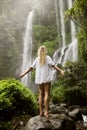 Beautiful woman and waterfall. Royalty Free Stock Photo