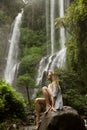 Beautiful woman and waterfall. Royalty Free Stock Photo