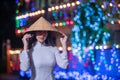 Beautiful woman wearing Ao Dai Vietnamese traditional dress and tourist