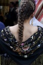 Beautiful woman wearing flamenco dress. Detail of Traditional Spanish Hairstyleat the April Fair Feria de Abril, Seville Fair Royalty Free Stock Photo
