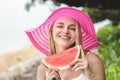 Beautiful woman wearing pink sunhat with watermelon Royalty Free Stock Photo