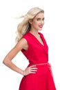 Beautiful woman wearing red dress smiling at camera Royalty Free Stock Photo