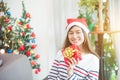 Beautiful woman wearing santa claus hat smiling