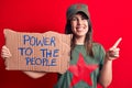 Beautiful woman wearing t-shirt with red star communist symbol asking for social movement smiling happy pointing with hand and