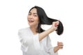 beautiful woman wearing a towel combing beautiful long hair with a comb Royalty Free Stock Photo