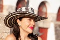 Beautiful woman wearing the traditional Colombian hat called Sombrero Vueltiao at the historical Calle de la Ronda of the Royalty Free Stock Photo