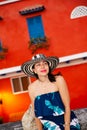 Beautiful woman wearing the traditional Colombian hat called Sombrero Vueltiao at the historical streets of the Cartagena de Royalty Free Stock Photo