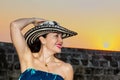 Beautiful woman wearing the traditional Colombian hat called Sombrero Vueltiao at the historical streets of the Cartagena de Royalty Free Stock Photo