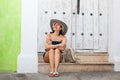 Beautiful woman wearing the traditional Colombian hat called Sombrero Vueltiao at the historical streets of the Cartagena de Royalty Free Stock Photo