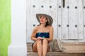 Beautiful woman wearing the traditional Colombian hat called Sombrero Vueltiao at the historical streets of the Cartagena de Royalty Free Stock Photo