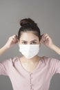 Close up woman face is wearing surgical mask Royalty Free Stock Photo