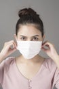 Close up woman face is wearing surgical mask Royalty Free Stock Photo