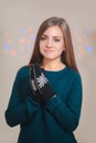 Beautiful woman wearing winter gloves