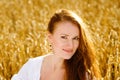 Beautiful woman on wheat field Royalty Free Stock Photo