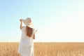 Beautiful woman in wheat field on sunny day Royalty Free Stock Photo