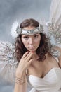 Beautiful woman in white dress with angel wings