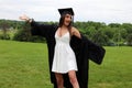 Beautiful woman in white dress and black Cap, Gown and Tass, teenager. Unique gorgeous face, nice smile, wonderful eyes girl.