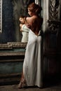 Beautiful woman in white dress with naked back. Royalty Free Stock Photo