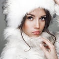 Beautiful woman in white fur coat and fur hat Royalty Free Stock Photo