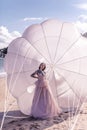 Beautiful woman with white parachute at the beach background portrait beauty portrait photoshoot Royalty Free Stock Photo