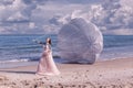 Beautiful woman with white parachute at the beach background portrait beauty portrait photoshoot Royalty Free Stock Photo
