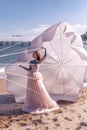 Beautiful woman with white parachute at the beach background portrait beauty portrait photoshoot Royalty Free Stock Photo